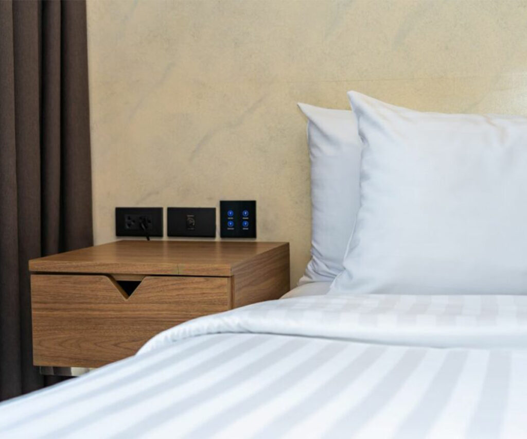 Smart bedroom features like built-in outlets and digital controls reflect 2025 bedroom trends.